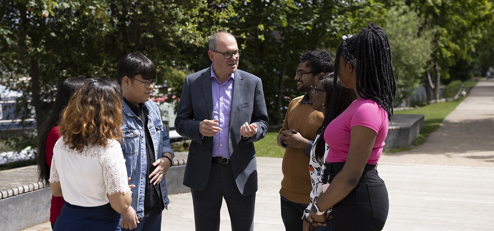 Multicultural people talking. Outside. Smiling