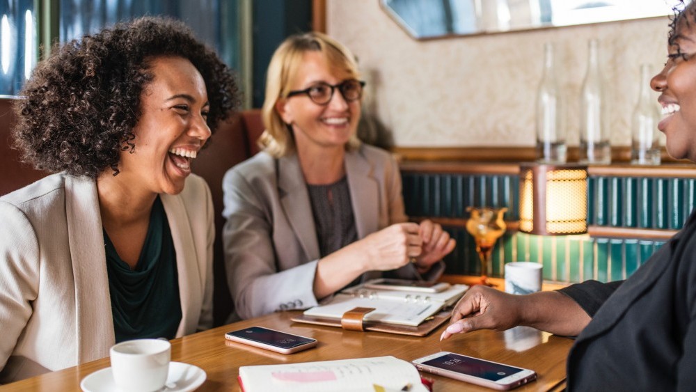 Group of women chatting over coffee