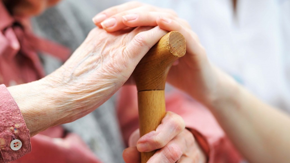 senior woman with her caregiver at home